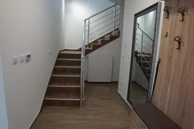 a staircase in a room with a mirror at LipaHill Luxe in Ripanj
