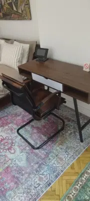 a desk with a laptop sitting on top of it at Kostas Apartment in Belgrade
