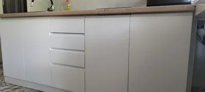 a kitchen with white cabinets and a sink at Kostas Apartment in Belgrade