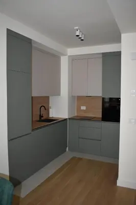 a kitchen with white cabinets and a sink at Apartment Luxe Corner BW in Belgrade