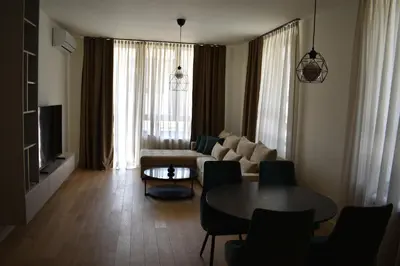 a living room with a couch and a table at Apartment Luxe Corner BW in Belgrade