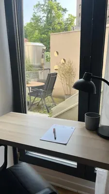 a desk with a pen and a paper on it at Lux love and family nest next to Skadarlija in Belgrade