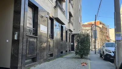 an empty city street with buildings and a car at Lux love and family nest next to Skadarlija in Belgrade