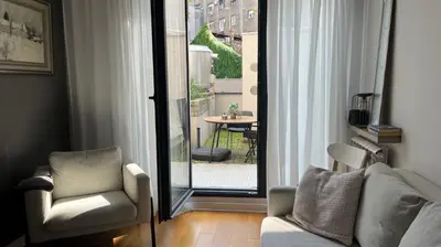 a living room with a couch and a chair at Lux love and family nest next to Skadarlija in Belgrade