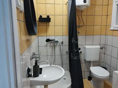 a bathroom with a sink and a toilet at Bulevar in Belgrade
