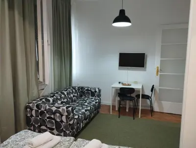 a living room with a couch and a table at Bulevar in Belgrade