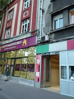 a man is standing in front of a building at Bulevar in Belgrade