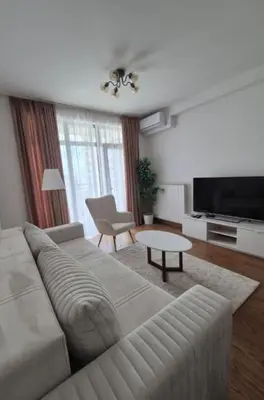 a living room with a couch and a table at Apartment na vodi in Belgrade
