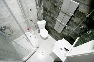 a bathroom with a shower and a toilet and a sink at Studio Intriga in Belgrade