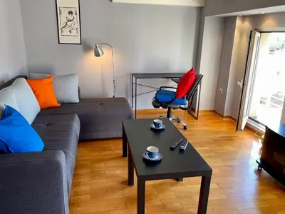 a living room with a couch and a table at Mirabel in Belgrade
