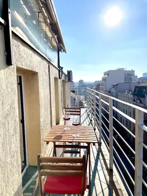a row of tables and chairs on a balcony at Mirabel in Belgrade