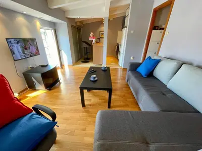 a living room with a couch and a coffee table at Mirabel in Belgrade