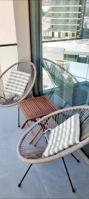 two chairs and a table on a balcony at BW Queen Apartman 412-whit free garage parking in Belgrade