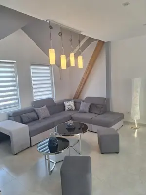 a living room with a couch and a table at Iva Lux2 in Belgrade