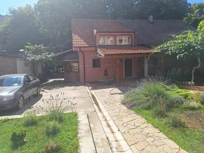 a house with a car parked in front of it at Iva Lux2 in Belgrade