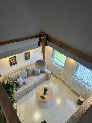 an overhead view of a living room with a couch and a table at Iva Lux in Belgrade