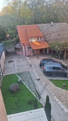 an aerial view of a house with cars parked in a yard at Iva Lux in Belgrade