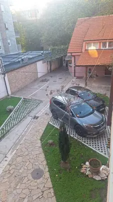 a car parked in the driveway of a house at Iva Lux in Belgrade