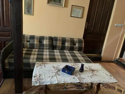 a living room with a couch and a table at Vikendica Mali Pozarevac