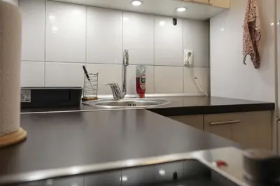 a kitchen with a sink and a counter top at Purple and Green in Belgrade