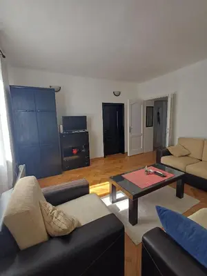a living room with couches and a coffee table at Glorry L in Belgrade