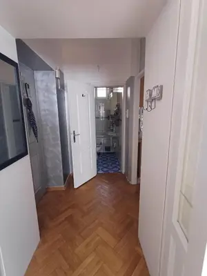 an empty hallway with a room with a bathroom at Glorry L in Belgrade