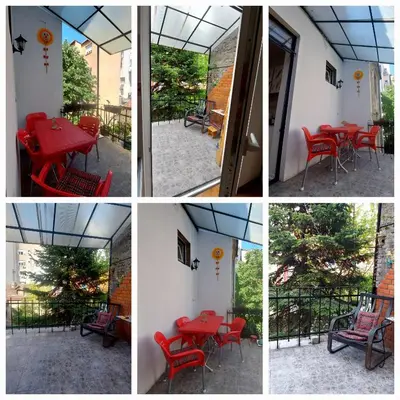 a group of four pictures with red tables and chairs at Glorry L in Belgrade