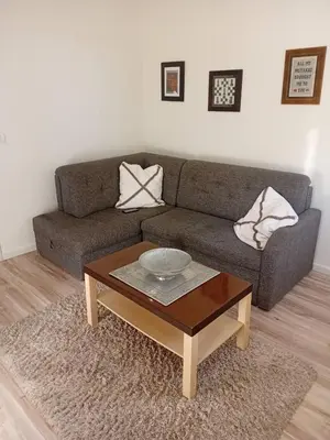 a living room with a couch and a coffee table at Senjak residence, apartment near Belgrade waterfront in Belgrade