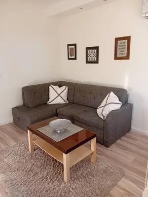 a living room with a couch and a coffee table at Senjak residence, apartment near Belgrade waterfront in Belgrade