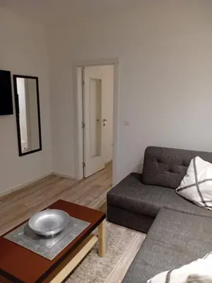 a living room with a couch and a table at Senjak residence, apartment near Belgrade waterfront in Belgrade