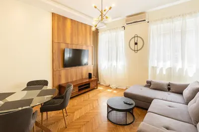 a living room with a couch and a table at MONE 2 bedroom apartment in Belgrade