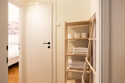 a room with a closet with a stack of towels at MONE 2 bedroom apartment in Belgrade
