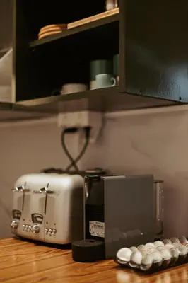 a toaster sitting on top of a wooden table at MONE 2 bedroom apartment in Belgrade