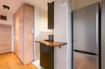 a kitchen with a counter and a refrigerator at MONE 2 bedroom apartment in Belgrade