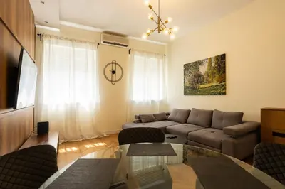 a living room with a couch and a table at MONE 2 bedroom apartment in Belgrade