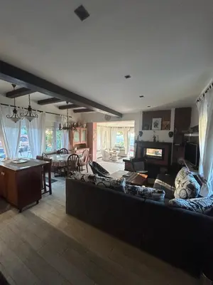 a large living room with a couch and a table at Panorama Beska in Beška