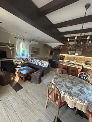 a living room with a table and a couch at Panorama Beska in Beška