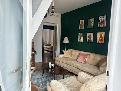 a living room with a couch and a table at Cozy aparts in the city heart in Belgrade