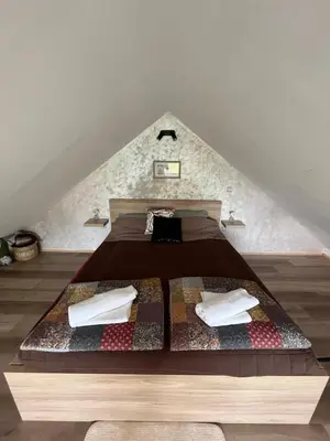a bed in the middle of a room at Elephant House-Sd