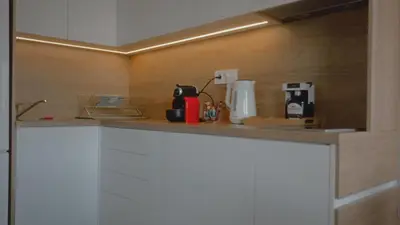 a kitchen with a counter with a coffee maker on it at Avalska Bajka in Ripanj