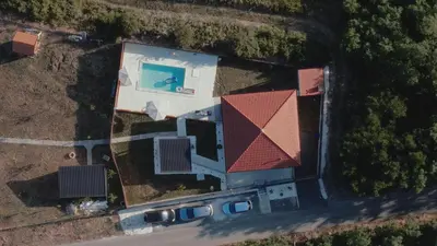an aerial view of a house with a swimming pool at Avalska Bajka in Ripanj