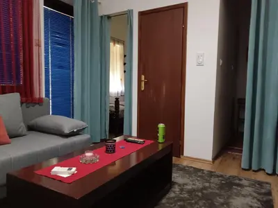 a living room with a couch and a coffee table at Beograd-Zvezdara in Belgrade