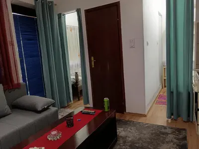 a living room with a couch and a table at Beograd-Zvezdara in Belgrade