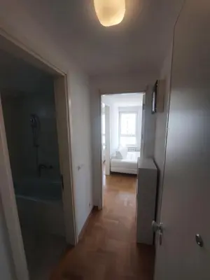 a room with a bathroom with a tub and a bedroom at DELTA CITY Apartment in Novi Beograd