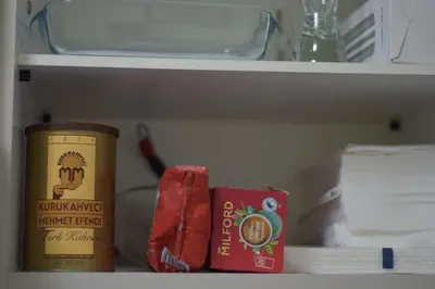a shelf of a refrigerator with a can of food at Apartment Perfetto in Belgrade