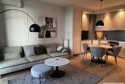 a living room with a couch and a table at BW Wilson in Belgrade