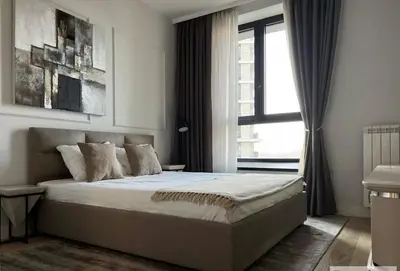 a bedroom with a large bed and a window at BW Wilson in Belgrade