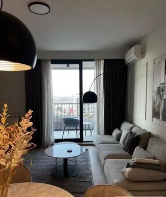 a living room with a couch and a table at BW Wilson in Belgrade