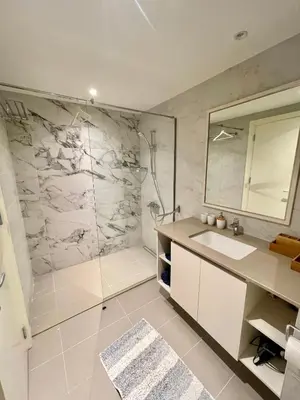 a bathroom with a shower and a sink and a mirror at Melania in Belgrade