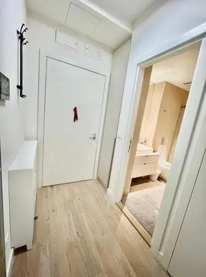 a room with a white door and a mirror at BW Studio Metropolitan in Belgrade